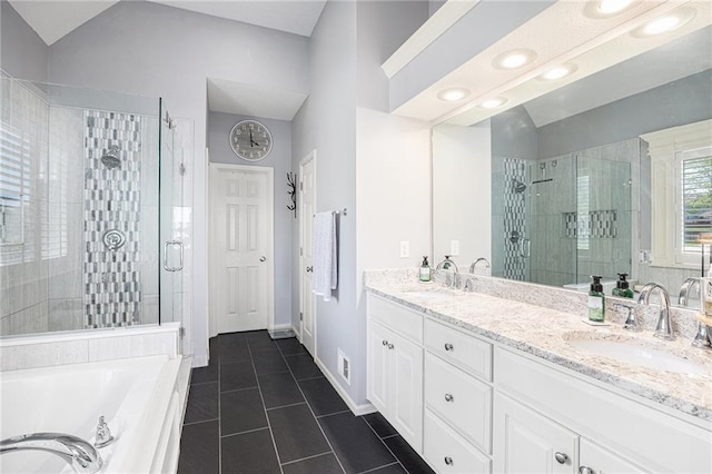 4307 N 110th Ter, Kansas City, KS 66109 - bathroom featuring a stall shower, tile patterned flooring, double vanity, a garden tub, and lofted ceiling