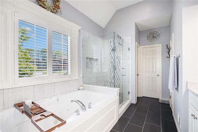 4307 N 110th Ter, Kansas City, KS 66109 - full bathroom with a shower stall, vanity, a jetted tub, tile patterned flooring, and lofted ceiling