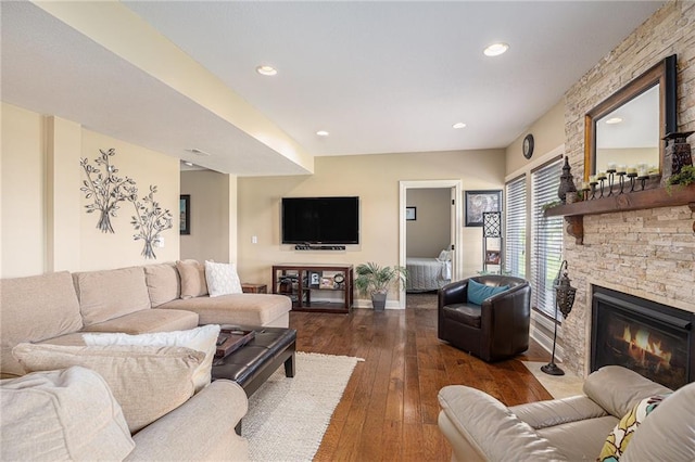 4307 N 110th Ter, Kansas City, KS 66109 - living room featuring dark wood-style floors, a stone fireplace, and recessed lighting