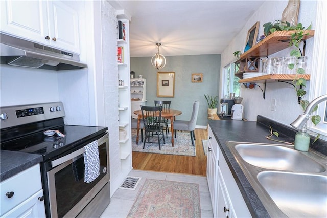 5904 N Howard Ave, Gladstone, MO 64118 - kitchen featuring stainless steel range with electric stovetop, under cabinet range hood, a sink, open shelves, and white cabinets