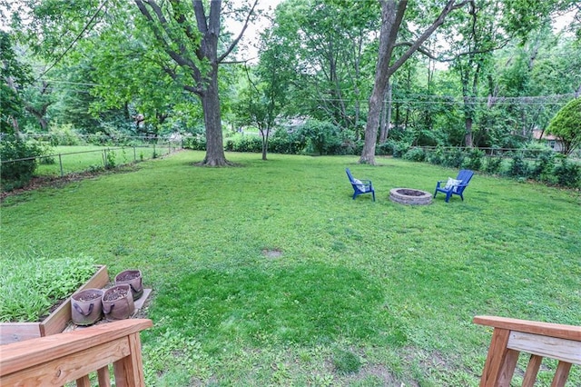 5904 N Howard Ave, Gladstone, MO 64118 - view of yard featuring an outdoor fire pit