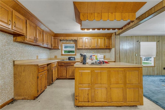 39135 Plum Creek Rd, Osawatomie, KS 66064 - kitchen featuring brown cabinets, light countertops, and light colored carpet