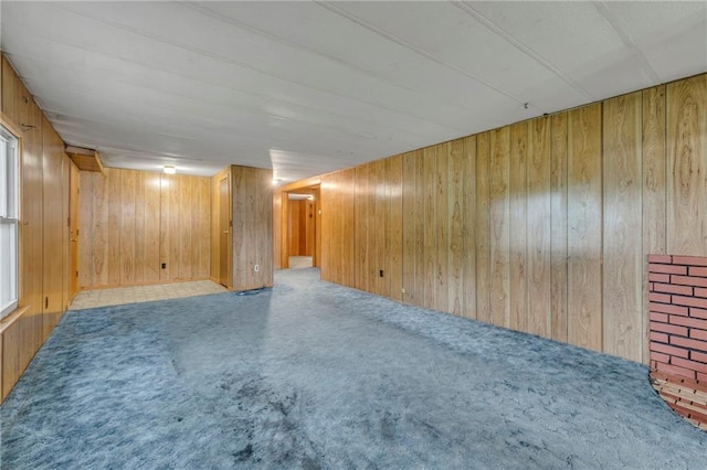 39135 Plum Creek Rd, Osawatomie, KS 66064 - unfurnished room featuring wood walls and carpet
