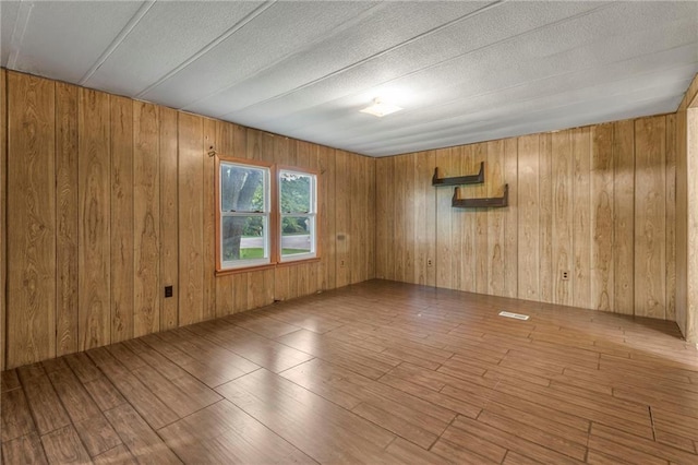 39135 Plum Creek Rd, Osawatomie, KS 66064 - unfurnished room with wooden walls and wood finished floors