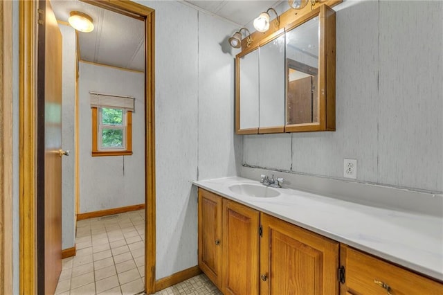 39135 Plum Creek Rd, Osawatomie, KS 66064 - bathroom with vanity, baseboards, and tile patterned flooring