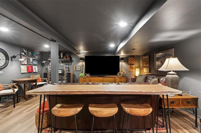 4325 W 112th St, Leawood, KS 66211 - bar area featuring light wood-type flooring and recessed lighting