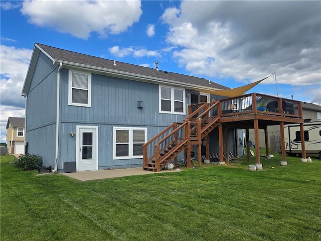 657 SW Tisha Ln, Grain Valley, MO 64029 - back of house with stairs, a wooden deck, a yard, and a patio area