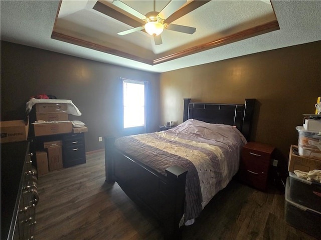 657 SW Tisha Ln, Grain Valley, MO 64029 - bedroom with a raised ceiling, dark wood-style floors, ceiling fan, and a textured ceiling