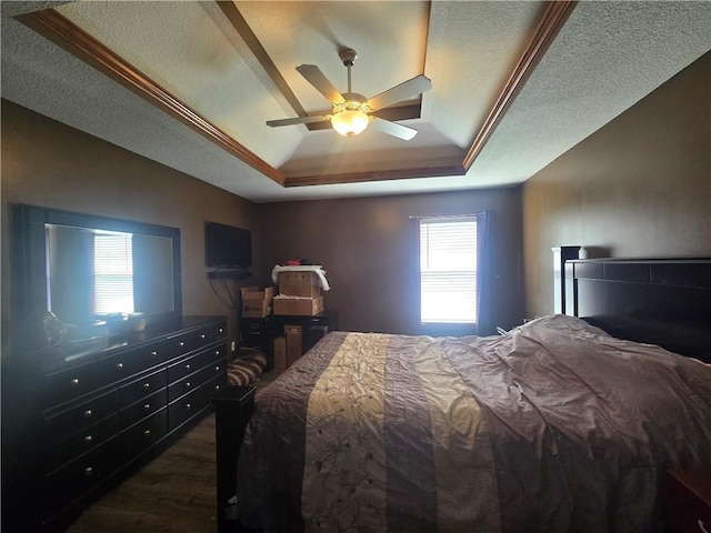 657 SW Tisha Ln, Grain Valley, MO 64029 - bedroom featuring a raised ceiling, dark wood-type flooring, and a ceiling fan