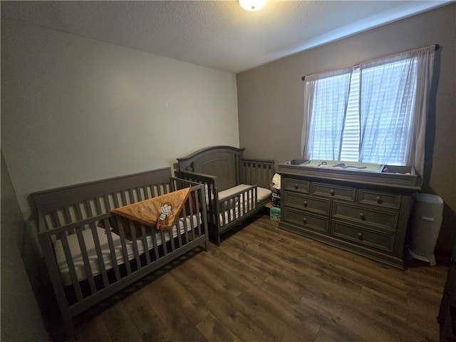 657 SW Tisha Ln, Grain Valley, MO 64029 - unfurnished bedroom with dark wood-type flooring
