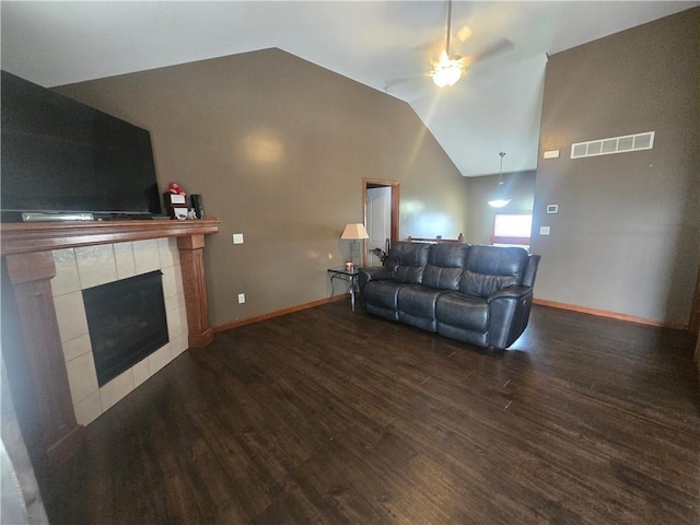 657 SW Tisha Ln, Grain Valley, MO 64029 - living room with a ceiling fan, lofted ceiling, wood finished floors, and a tile fireplace