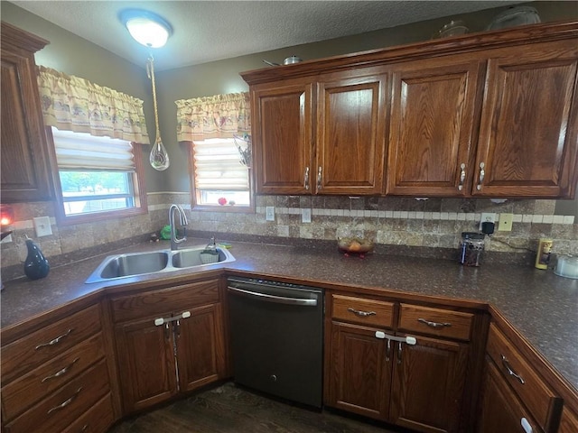 657 SW Tisha Ln, Grain Valley, MO 64029 - kitchen with dishwasher, a sink, and dark countertops