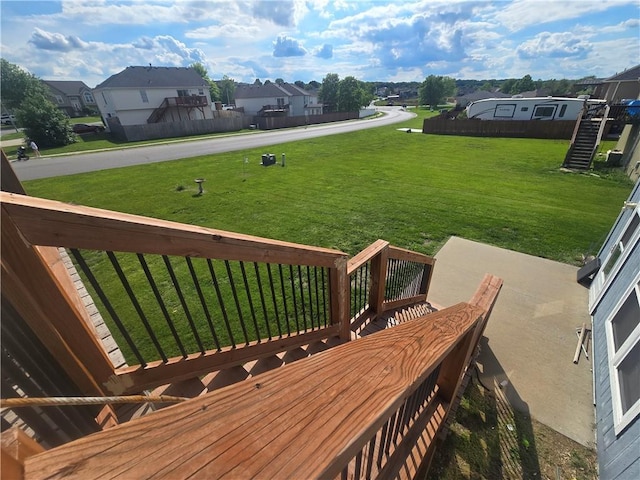 657 SW Tisha Ln, Grain Valley, MO 64029 - wooden deck featuring a yard and a residential view