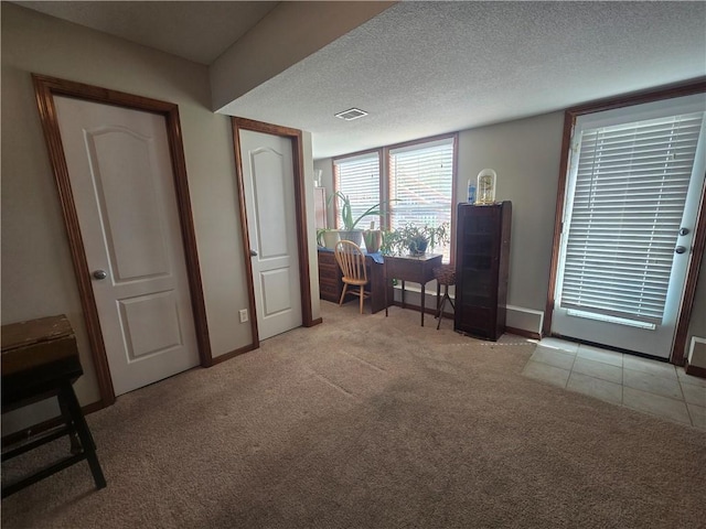657 SW Tisha Ln, Grain Valley, MO 64029 - living area with light carpet, baseboards, and a textured ceiling