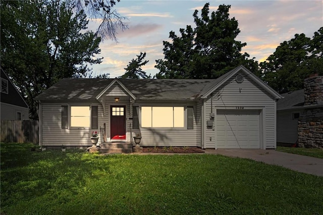1304 6th Ave, Leavenworth, KS 66048 - ranch-style house with concrete driveway and an attached garage