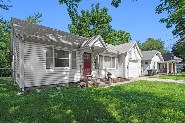 1304 6th Ave, Leavenworth, KS 66048 - view of front of house featuring a garage, driveway, and a front yard