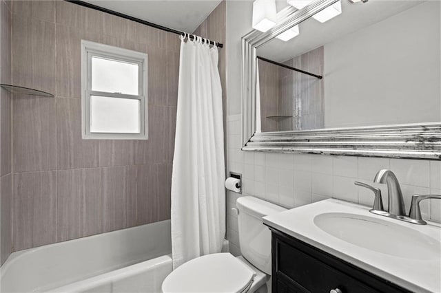 1304 6th Ave, Leavenworth, KS 66048 - full bathroom featuring tile walls, vanity, and shower / bath combination with curtain