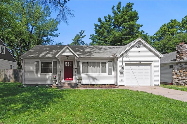 1304 6th Ave, Leavenworth, KS 66048 - view of front of house featuring a garage and concrete driveway