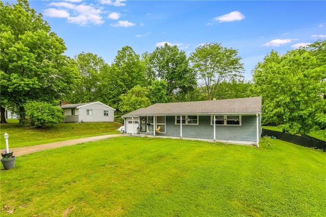 808 NE 62nd St, Gladstone, MO 64118 - view of front of home with driveway, a front yard, and a garage