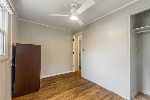 808 NE 62nd St, Gladstone, MO 64118 - unfurnished bedroom with wood finished floors, ornamental molding, ceiling fan, and baseboards