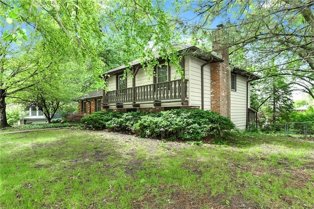 1131 Wildwood St, Leavenworth, KS 66048 - view of side of home featuring a chimney