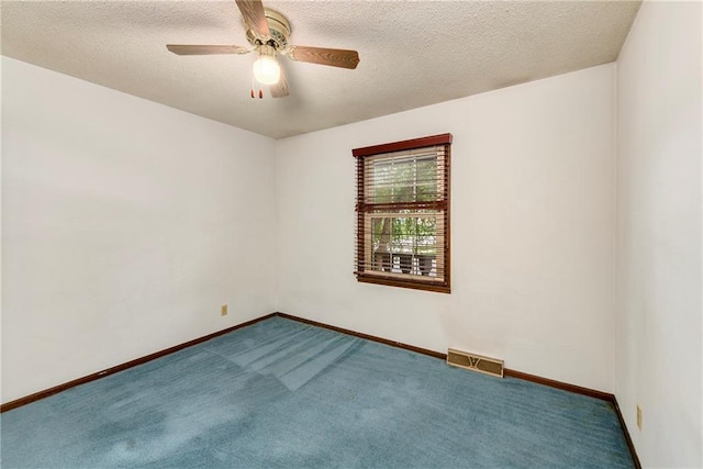 1131 Wildwood St, Leavenworth, KS 66048 - carpeted spare room with ceiling fan, baseboards, and a textured ceiling