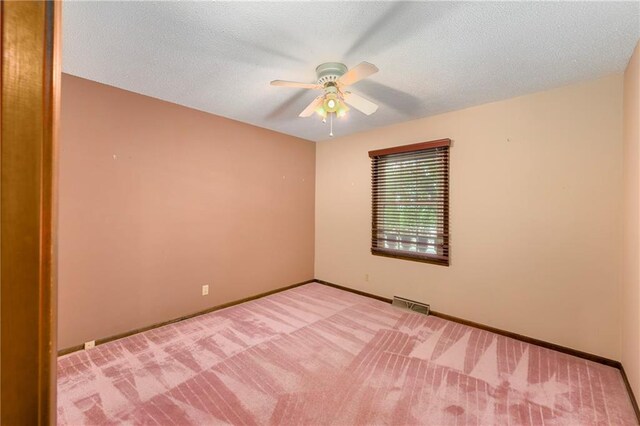 1131 Wildwood St, Leavenworth, KS 66048 - spare room with ceiling fan, carpet floors, baseboards, and a textured ceiling