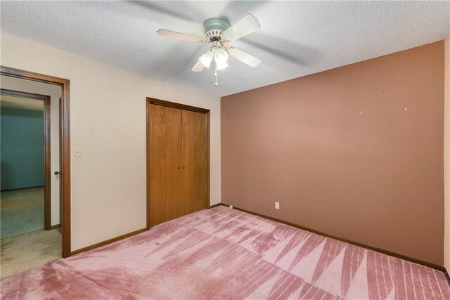 1131 Wildwood St, Leavenworth, KS 66048 - unfurnished bedroom with carpet, a closet, a ceiling fan, a textured ceiling, and baseboards