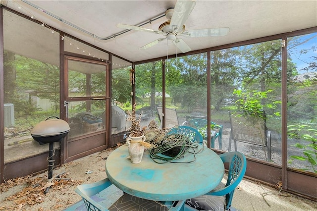 1131 Wildwood St, Leavenworth, KS 66048 - sunroom with ceiling fan and outdoor dining space