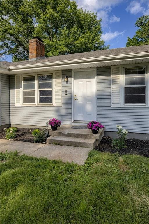 9203 James A Reed Rd, Kansas City, MO 64138 - entrance to property with a chimney
