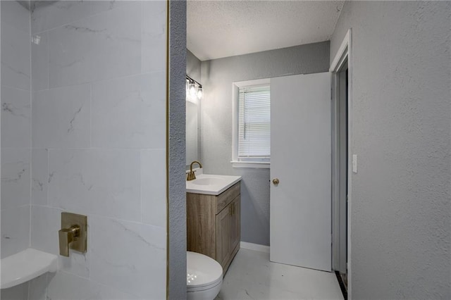 9203 James A Reed Rd, Kansas City, MO 64138 - bathroom with toilet, vanity, a textured wall, and a textured ceiling