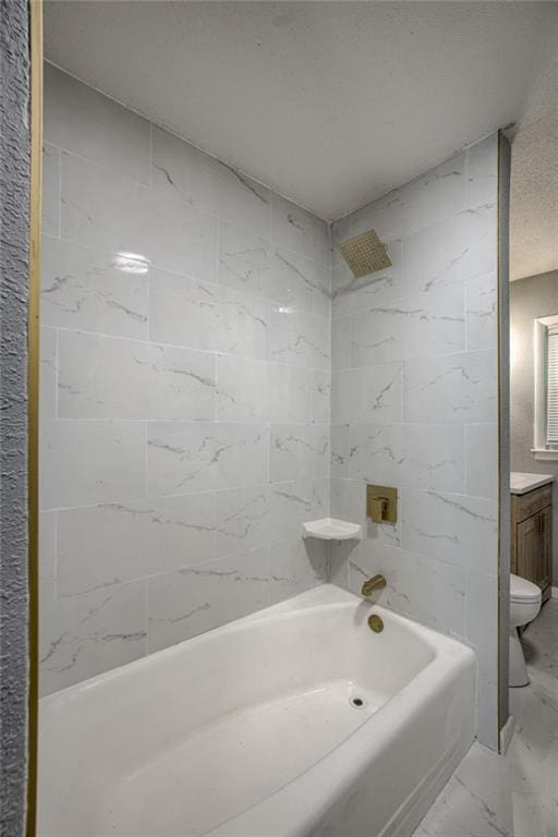 9203 James A Reed Rd, Kansas City, MO 64138 - bathroom featuring toilet, marble finish flooring,  shower combination, and vanity