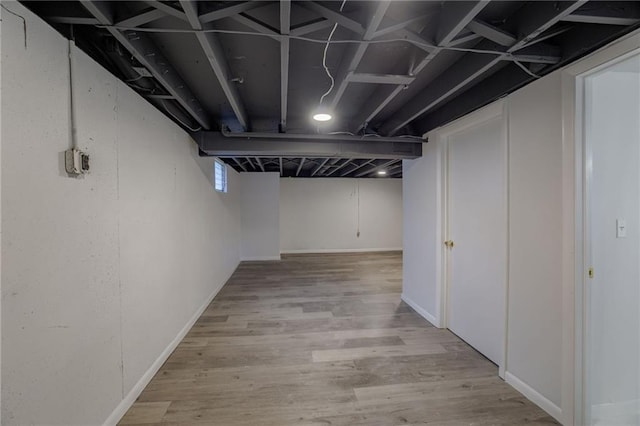9203 James A Reed Rd, Kansas City, MO 64138 - finished basement with wood finished floors and baseboards