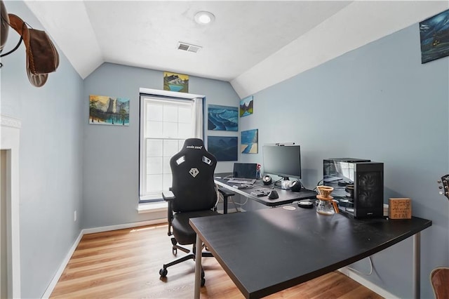 11580 S Skyview Ln, Olathe, KS 66061 - office area with lofted ceiling, wood finished floors, and baseboards