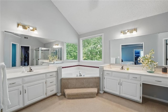 11580 S Skyview Ln, Olathe, KS 66061 - ensuite bathroom featuring a shower stall, vaulted ceiling, two vanities, and a garden tub