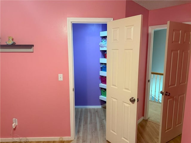 11580 S Skyview Ln, Olathe, KS 66061 - hallway with wood finished floors and baseboards