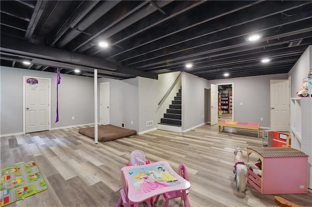 11580 S Skyview Ln, Olathe, KS 66061 - rec room with wood finished floors and baseboards