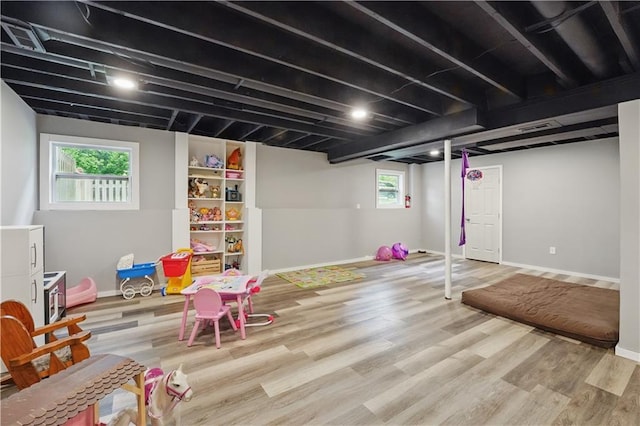 11580 S Skyview Ln, Olathe, KS 66061 - rec room with wood finished floors and baseboards