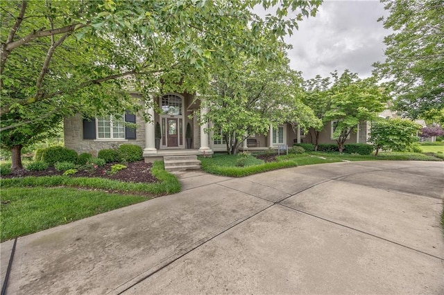 14606 Granada Rd, Leawood, KS 66224 - view of property hidden behind natural elements with stone siding and a front yard