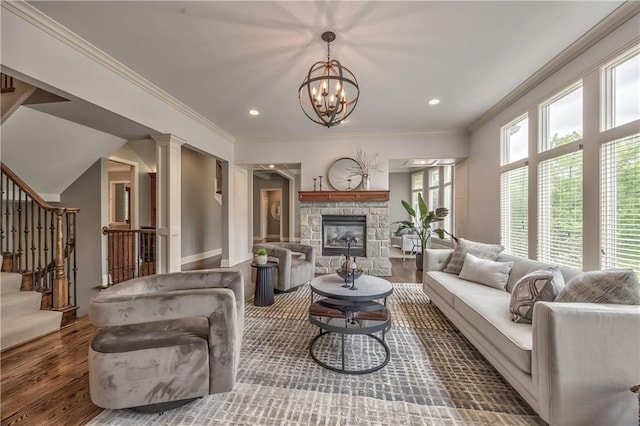 14606 Granada Rd, Leawood, KS 66224 - living room with wood finished floors, stairs, a chandelier, crown molding, and a stone fireplace