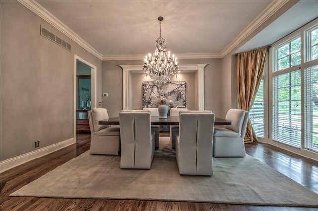 14606 Granada Rd, Leawood, KS 66224 - dining space with a chandelier, wood finished floors, baseboards, and ornamental molding