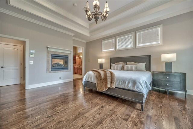14606 Granada Rd, Leawood, KS 66224 - bedroom featuring crown molding, a chandelier, wood finished floors, baseboards, and a raised ceiling