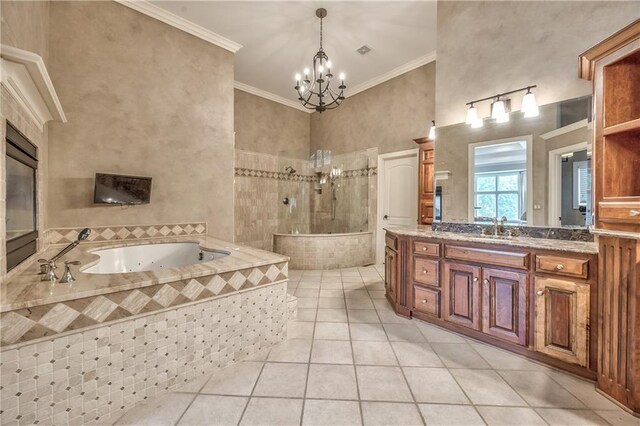 14606 Granada Rd, Leawood, KS 66224 - full bath featuring tile patterned flooring, a whirlpool tub, vanity, a chandelier, and a walk in shower