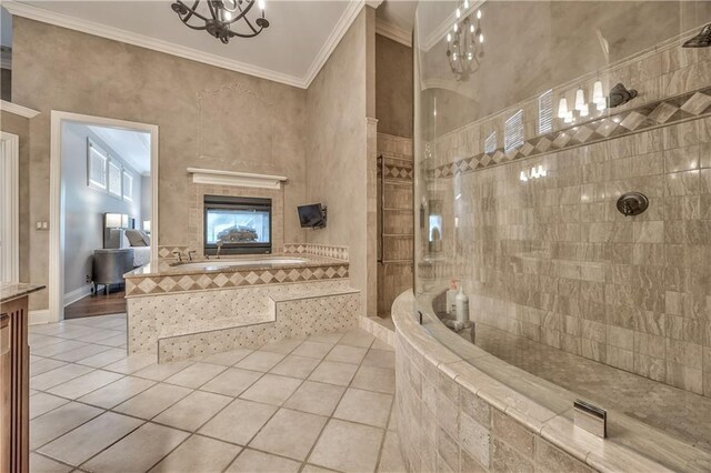 14606 Granada Rd, Leawood, KS 66224 - full bathroom featuring tile patterned floors, ornamental molding, a garden tub, a walk in shower, and vanity