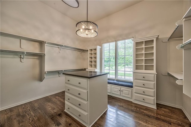 14606 Granada Rd, Leawood, KS 66224 - spacious closet with a chandelier, dark wood-style flooring, and a high ceiling