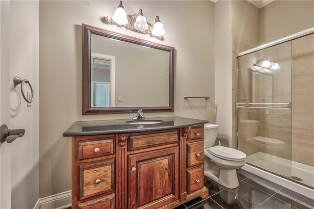 14606 Granada Rd, Leawood, KS 66224 - bathroom featuring toilet, a shower stall, vanity, and tile patterned floors