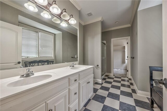 14606 Granada Rd, Leawood, KS 66224 - full bath featuring tile patterned floors, a shower stall, double vanity, baseboards, and crown molding