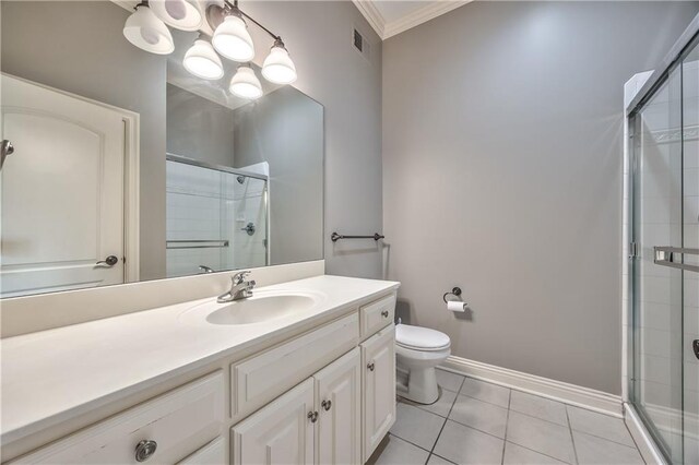 14606 Granada Rd, Leawood, KS 66224 - bathroom featuring a shower stall, toilet, vanity, crown molding, and tile patterned floors
