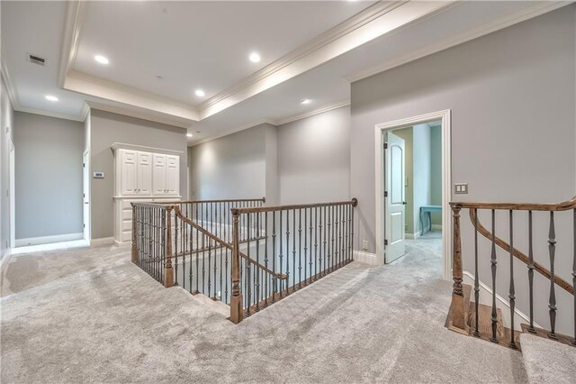 14606 Granada Rd, Leawood, KS 66224 - hallway with an upstairs landing, crown molding, light carpet, recessed lighting, and a tray ceiling