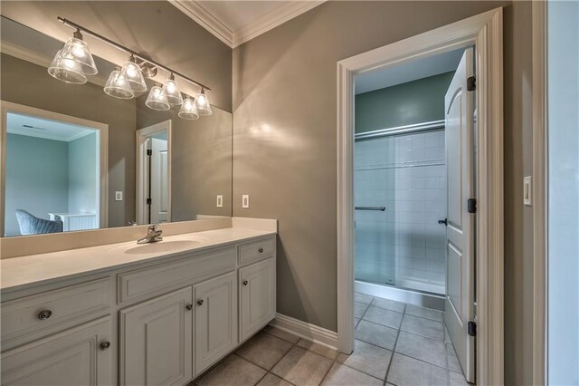 14606 Granada Rd, Leawood, KS 66224 - bathroom featuring crown molding, vanity, a shower stall, tile patterned flooring, and baseboards